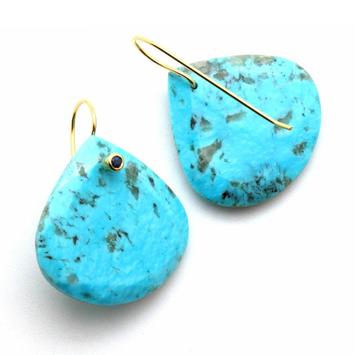These faceted turquoise drop earrings feature blue sapphires set in the 18k yellow gold ear wires. The measure 25mm in diameter at their widest point. To know more details please visit here https://eyeonjewels.com/product/wide-turquoise-teardrop-earrings-19505