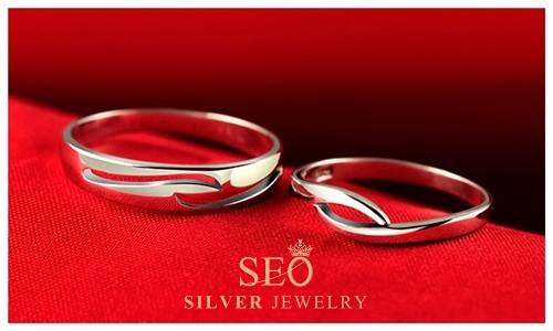 b_silver_open_wave_engagement_rings.jpg