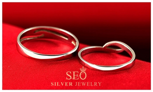 c_silver_open_wave_engagement_rings.jpg