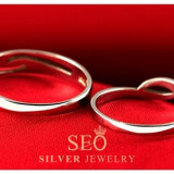 c_silver_open_wave_engagement_rings